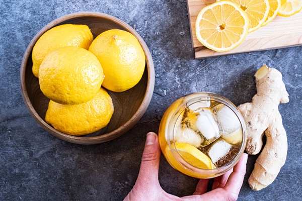 Switchel Recipe with Cider Vinegar & Molasses and a bowl of lemon