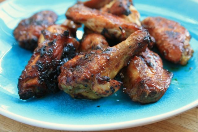 Asian-inspired chicken wings on a blue plate