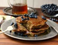 Whole wheat zucchini pancakes are hearty and wholesome and include one serving of vegetables in each portion.