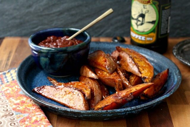 This easy recipe for spicy molasses roasted sweet potatoes makes it easy to eat more vegetables. The marinade has some tang from the vinegar and bite from the mustard and hot sauce which balance the sweet of the potatoes. 