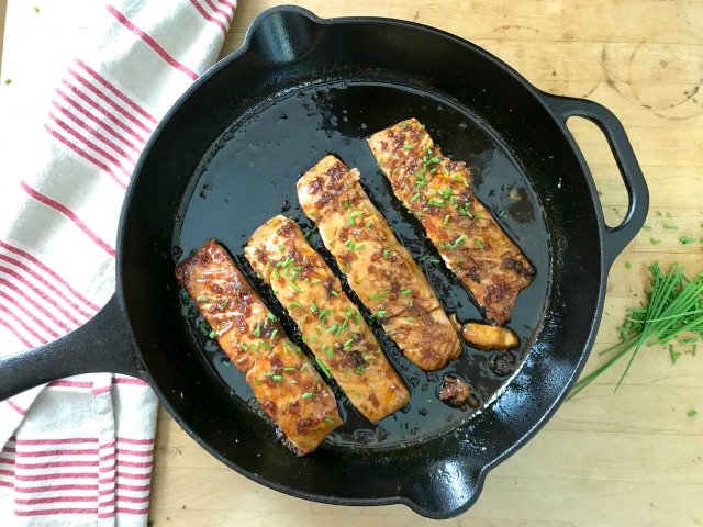 Garlicky orange juice salmon recipe in cast iron skillet