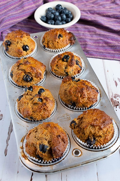 blueberry wheat germ muffins on a tray