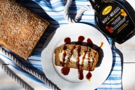 Oatmeal Maple + Molasses Bread with drizzle and butter